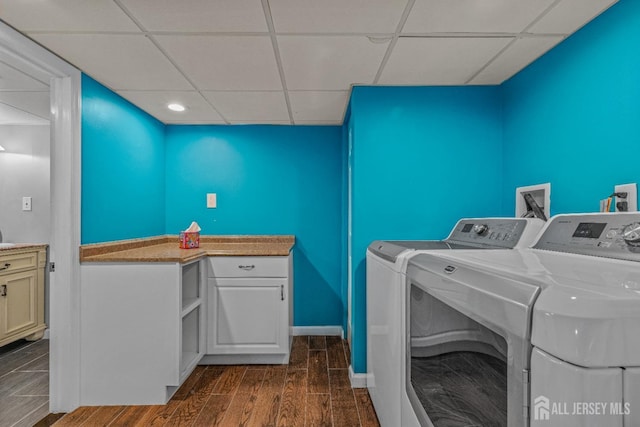 washroom featuring separate washer and dryer and dark hardwood / wood-style floors