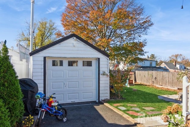 garage with a yard