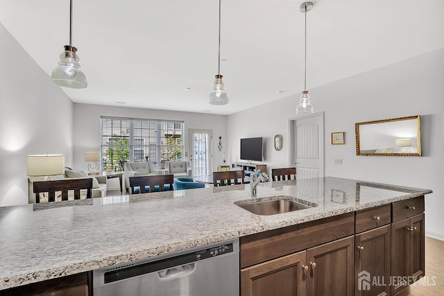 30 Grabowski Dr, Sayreville, NJ 08859 - kitchen with stainless steel dishwasher, open floor plan, hanging light fixtures, and dark brown cabinets