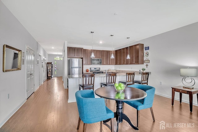30 Grabowski Dr, Sayreville, NJ 08859 - dining room with light wood-style flooring and recessed lighting