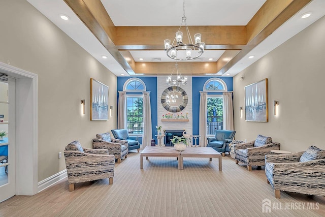 30 Grabowski Dr, Sayreville, NJ 08859 - living area with a chandelier, a tray ceiling, plenty of natural light, and a large fireplace