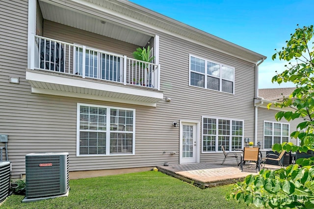 30 Grabowski Dr, Sayreville, NJ 08859 - rear view of property featuring a balcony, a patio area, and a yard