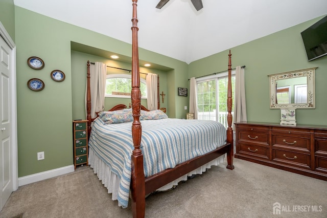 307 Cedar Dr, Lacey, NJ 08734 - bedroom featuring light carpet, access to exterior, multiple windows, and lofted ceiling