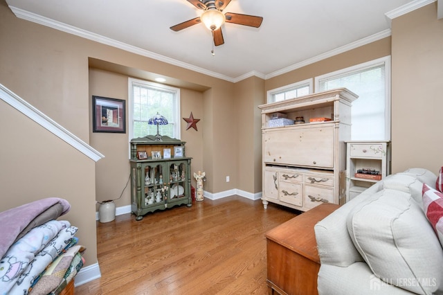 307 Cedar Dr, Lacey, NJ 08734 - living room featuring ceiling fan, light wood-type flooring, crown molding, and baseboards