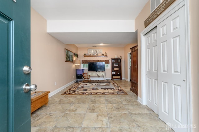 307 Cedar Dr, Lacey, NJ 08734 - foyer featuring baseboards and stone finish floors
