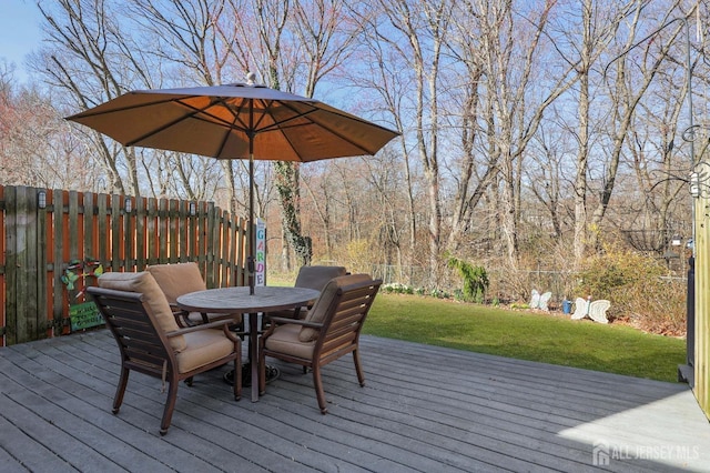 wooden deck featuring outdoor dining space
