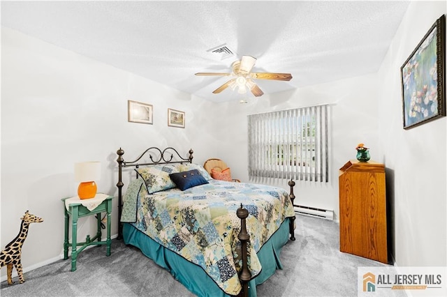 carpeted bedroom featuring baseboard heating, ceiling fan, and a textured ceiling