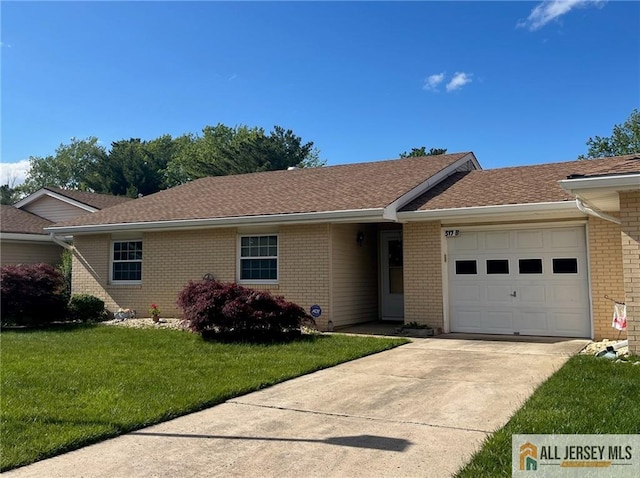 517 Hazen Rd Unit B, Monroe, NJ 08831 - single story home featuring brick siding, a front lawn, a garage, driveway, and roof with shingles