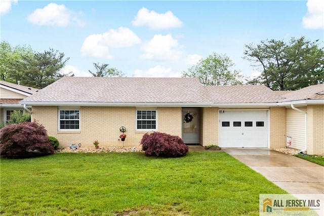 single story home featuring driveway, brick siding, a garage, and a front lawn