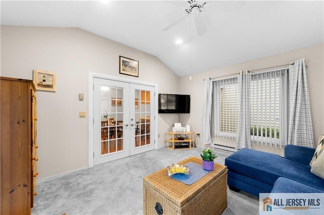 carpeted living area with french doors, vaulted ceiling, ceiling fan, and baseboards
