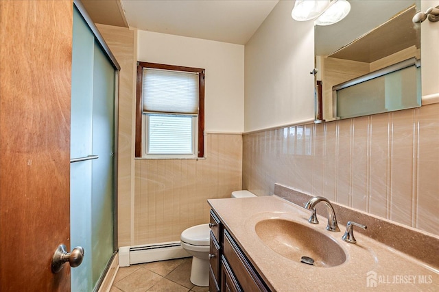 bathroom with a shower with shower door, tile walls, baseboard heating, toilet, and tile patterned floors