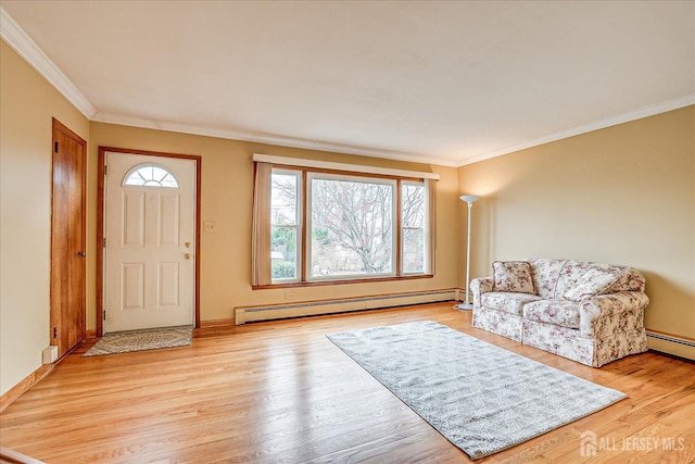 foyer featuring baseboard heating, crown molding, and light hardwood / wood-style flooring