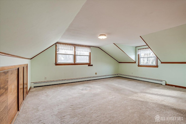 bonus room featuring light carpet and lofted ceiling