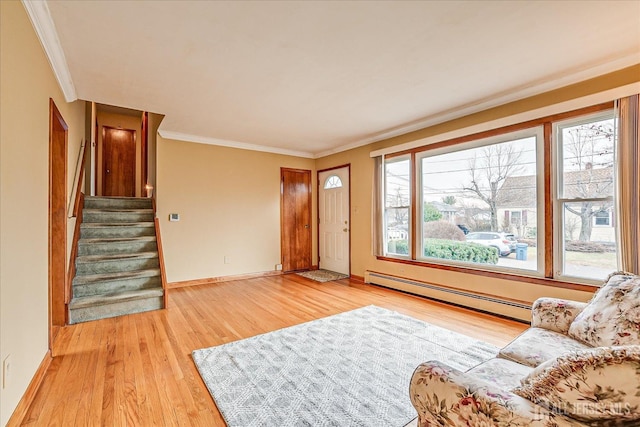 living room featuring a baseboard radiator, ornamental molding, and light hardwood / wood-style flooring