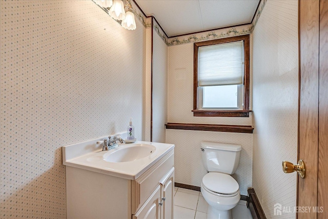 bathroom featuring tile patterned flooring, vanity, and toilet