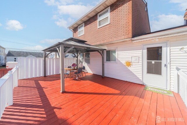 wooden deck featuring a gazebo