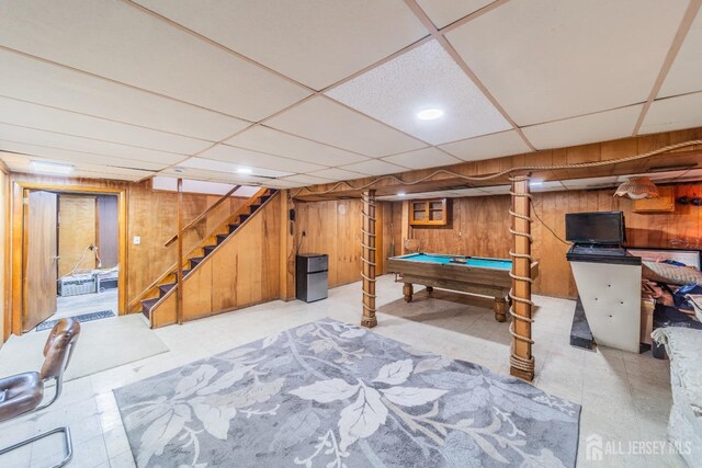 playroom with a drop ceiling, billiards, and wooden walls