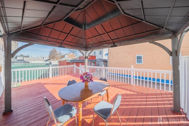 deck featuring a gazebo and a water view