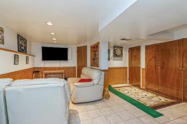 7 Sherbone Pl, Sayreville, NJ 08859 - living area with wainscoting, wood walls, light tile patterned floors, and recessed lighting