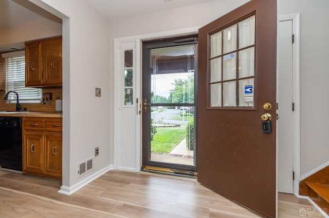 7 Sherbone Pl, Sayreville, NJ 08859 - entryway with light wood-style floors and baseboards