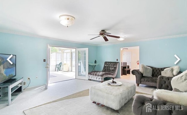 living area featuring a ceiling fan, crown molding, light colored carpet, french doors, and light tile patterned floors