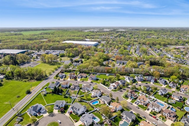bird's eye view featuring a forest view and a residential view