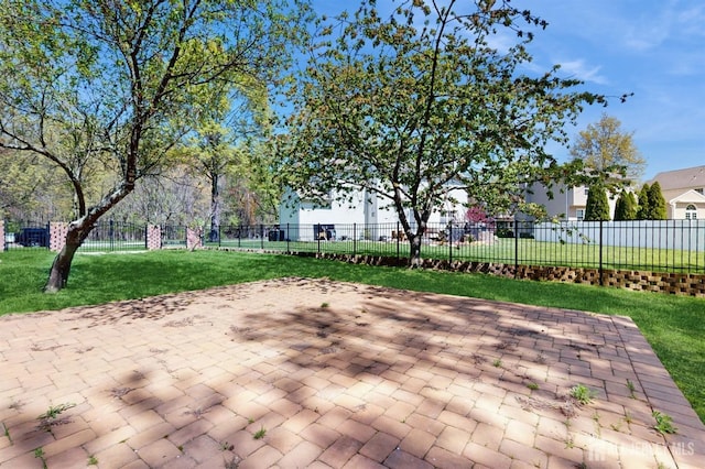 surrounding community with a lawn, a patio, and fence