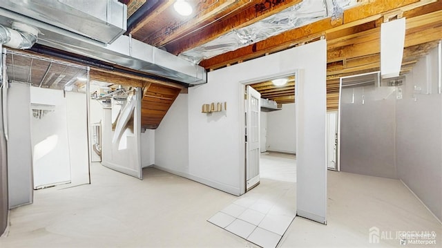 below grade area featuring baseboards