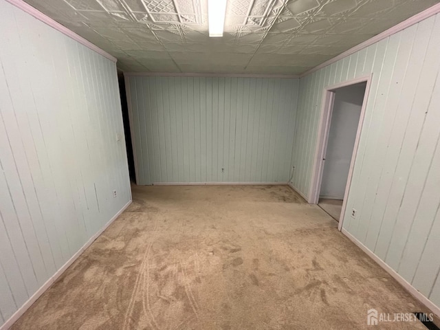 unfurnished room with light colored carpet