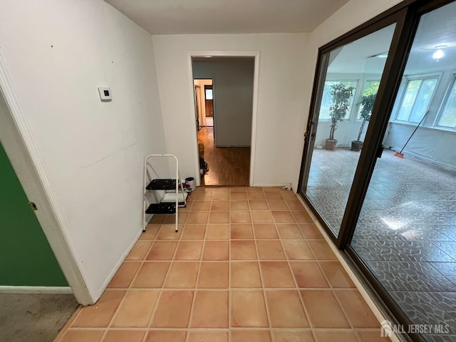 hallway with light tile patterned floors