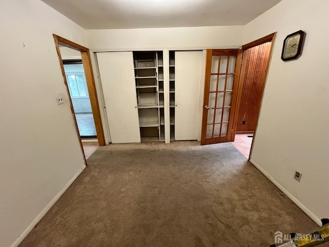 unfurnished bedroom featuring carpet flooring