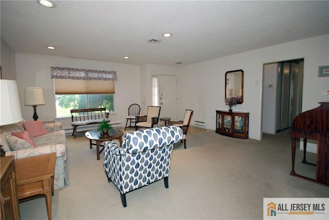 398 Fuchsia Plz Unit C, Monroe, NJ 08831 - carpeted living room featuring a baseboard heating unit, recessed lighting, and a textured ceiling