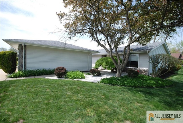 398 Fuchsia Plz Unit C, Monroe, NJ 08831 - view of home's exterior with a yard