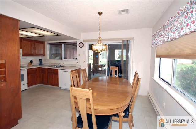 398 Fuchsia Plz Unit C, Monroe, NJ 08831 - dining area featuring a textured ceiling, a notable chandelier, light tile patterned floors, and visible vents