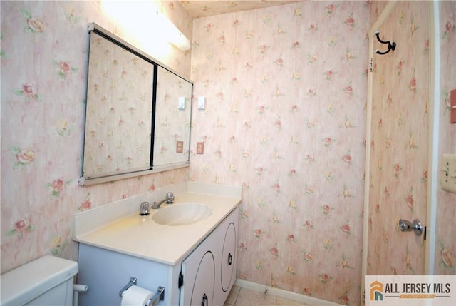 398 Fuchsia Plz Unit C, Monroe, NJ 08831 - bathroom with toilet, baseboards, tile patterned floors, and vanity
