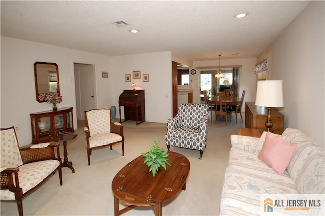 398 Fuchsia Plz Unit C, Monroe, NJ 08831 - carpeted living room featuring a notable chandelier, recessed lighting, and a textured ceiling