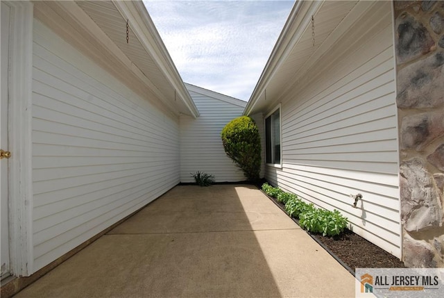 398 Fuchsia Plz Unit C, Monroe, NJ 08831 - view of side of home with a patio