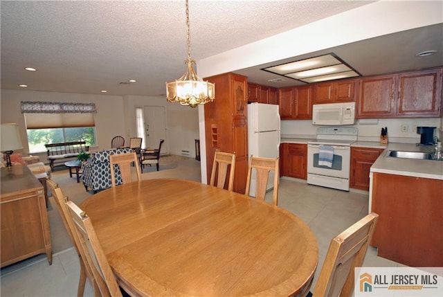 398 Fuchsia Plz Unit C, Monroe, NJ 08831 - dining space with a notable chandelier and a textured ceiling