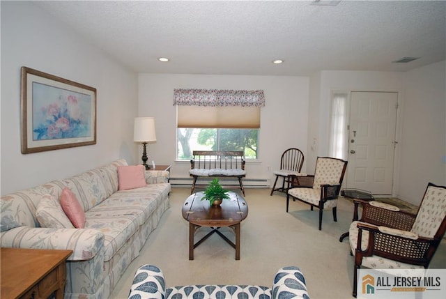 398 Fuchsia Plz Unit C, Monroe, NJ 08831 - living area with light colored carpet, a baseboard radiator, visible vents, and a textured ceiling