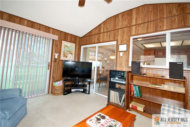 398 Fuchsia Plz Unit C, Monroe, NJ 08831 - living area featuring lofted ceiling, wood walls, a ceiling fan, and carpet