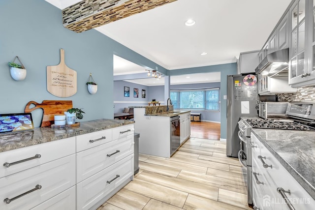 29 Dumas Rd, Old Bridge, NJ 08857 - kitchen featuring stainless steel appliances, exhaust hood, crown molding, glass insert cabinets, and stone countertops