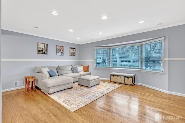 29 Dumas Rd, Old Bridge, NJ 08857 - living area with ornamental molding, recessed lighting, and wood finished floors