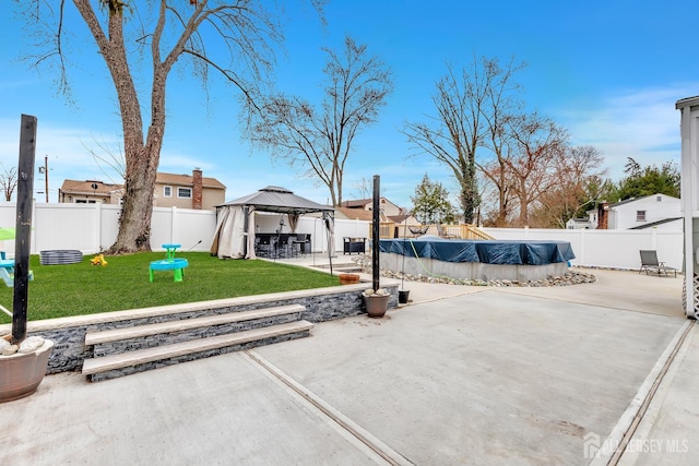 29 Dumas Rd, Old Bridge, NJ 08857 - fenced backyard featuring a gazebo and a patio area