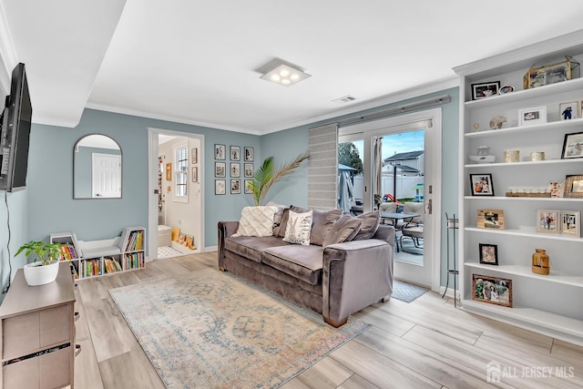 29 Dumas Rd, Old Bridge, NJ 08857 - living room featuring crown molding, light wood-style floors, and built in shelves