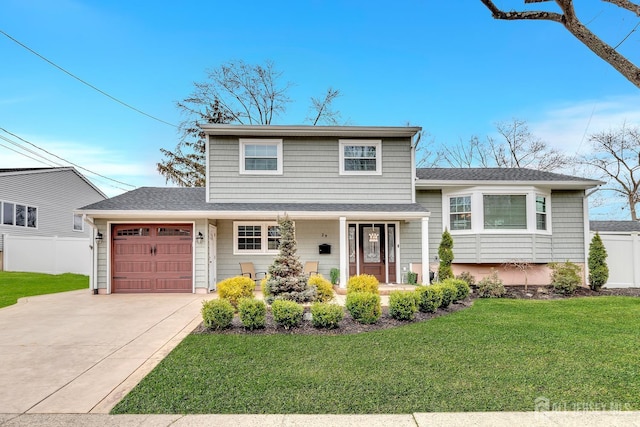 29 Dumas Rd, Old Bridge, NJ 08857 - split level home featuring an attached garage, concrete driveway, roof with shingles, and a porch