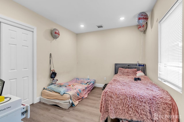 176 Main St, East Brunswick, NJ 08816 - bedroom with multiple windows, wood finished floors, and recessed lighting