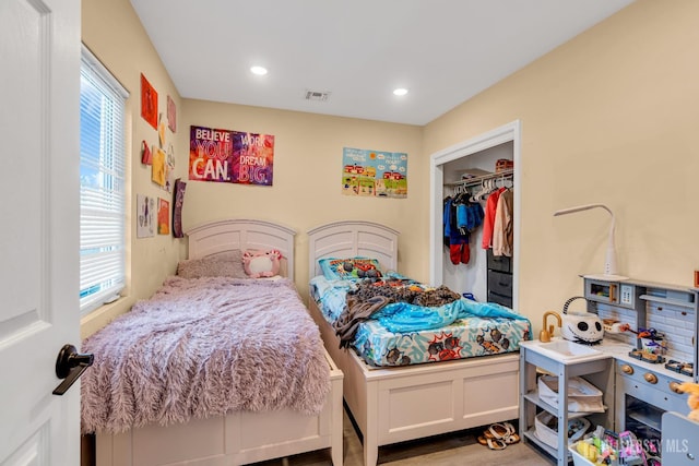 176 Main St, East Brunswick, NJ 08816 - bedroom featuring multiple windows, wood finished floors, a closet, and recessed lighting