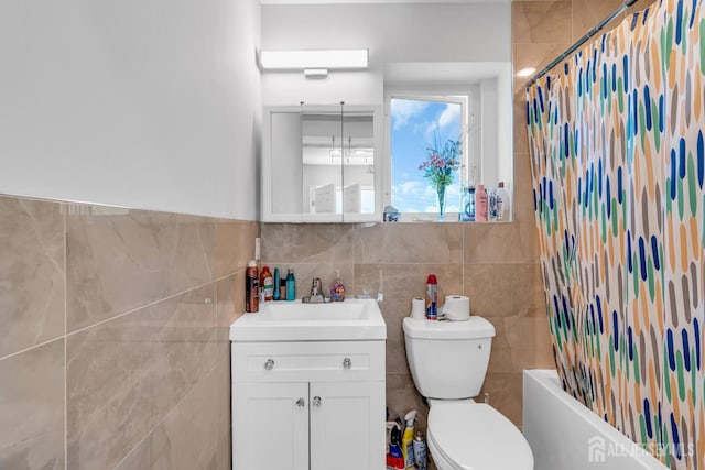 176 Main St, East Brunswick, NJ 08816 - full bathroom with tile walls, vanity, and shower / tub combo
