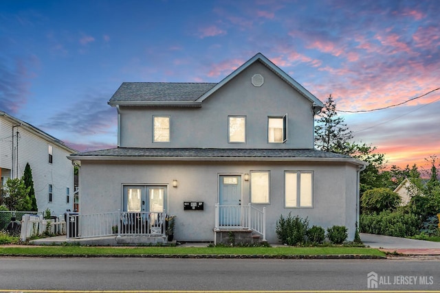 176 Main St, East Brunswick, NJ 08816 - traditional home with stucco siding and a shingled roof
