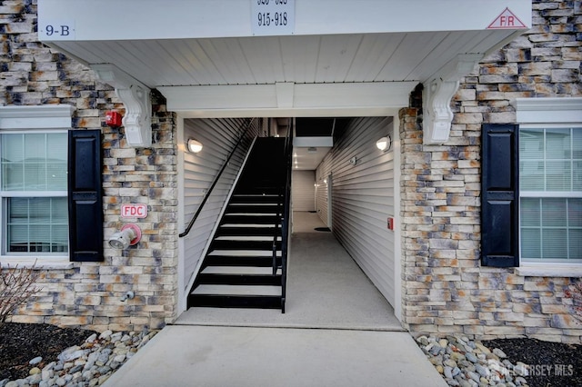 exterior space with stone siding